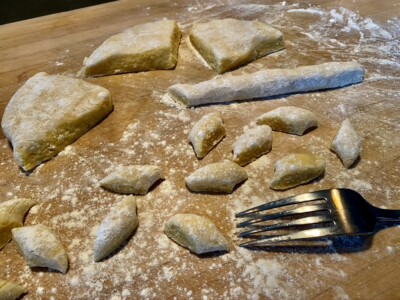 shape gnocchi on the tines of a fork shape gnocchi on the tines of a fork
